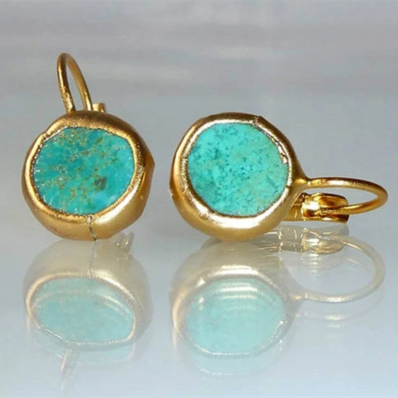 Gyldne øreringe med turquoise sten