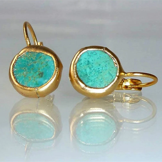 Gyldne øreringe med turquoise sten